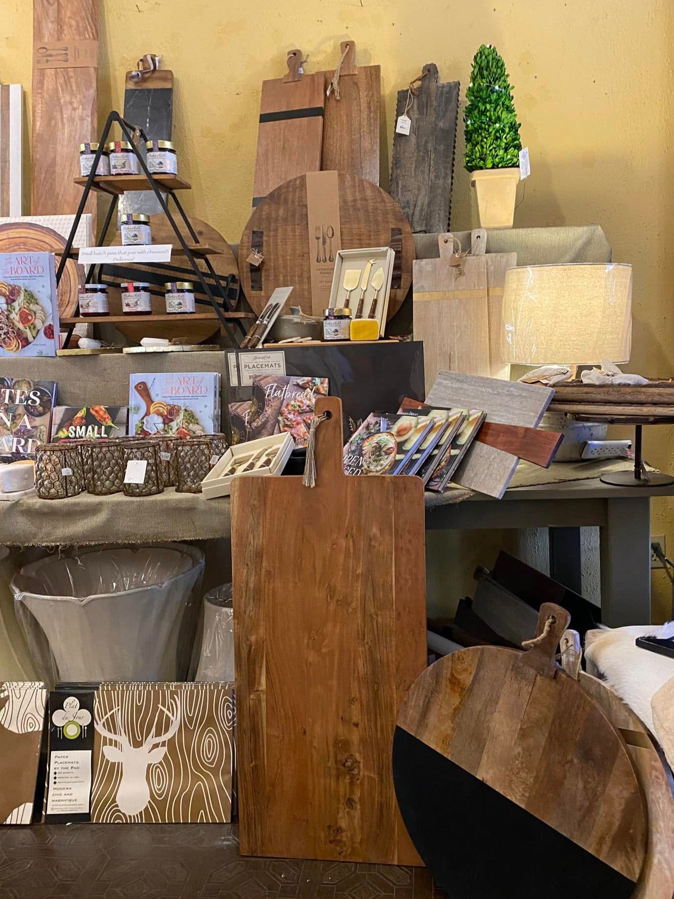 Display of wooden products and decor items in a store setting.